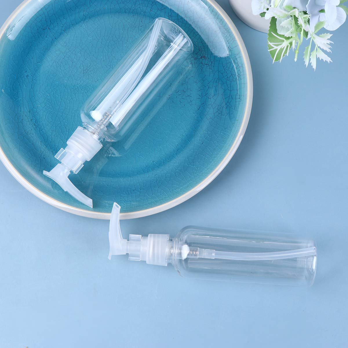 PRETYZOOM 4 pack Travel Pump Bottles 100ml Refillable Plastic Shampoo Dispenser Bottles with Pump for Lotion Liquid Soap Face Wash Essential Oil