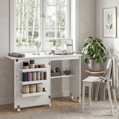 HOMCOM Folding Sewing Table, Drop Leaf Craft Table with Storage Bins, Open Shelf and Wheels, Rolling Sewing Machine Cabinet Computer Desk for Small Space, White